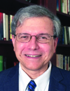 Claude A. Yusti
